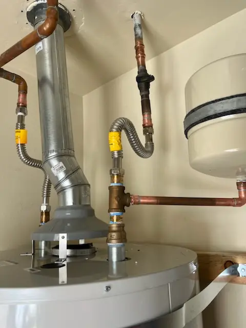 Water heater installation and plumbing repair in Roots